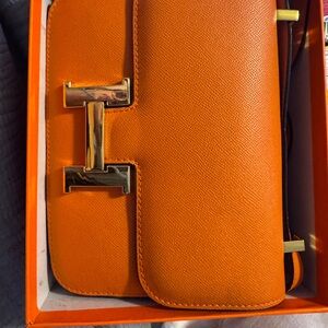 Hermes Orange Leather Clutch with Gold Hardware